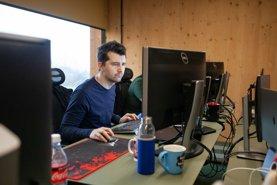 student coding at desk