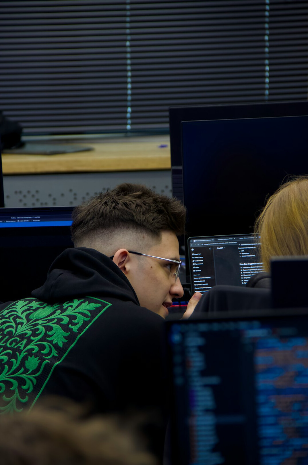 group of students discussing code